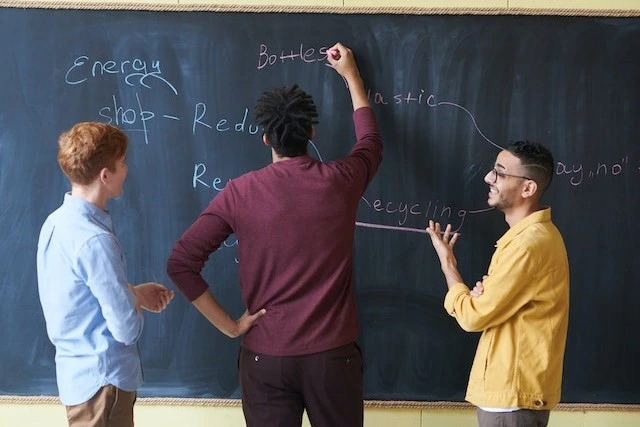 Three young men learning life skills